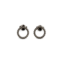 Delicate blackened silver ear studs made of fine, in a circle arranged beads. The earrings have a diameter of about 12mm.