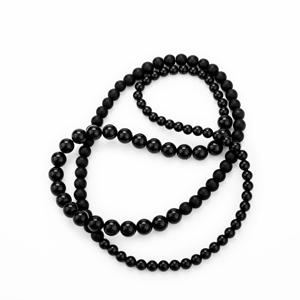 Chain in loops made of three different sized, round onyx balls. The balls of one size are in a row, so that there are three different areas of the chain.