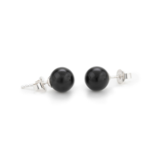 Two smooth black spheres of onyx, 8mm in diameter, are made into stud earrings with a silver pin.