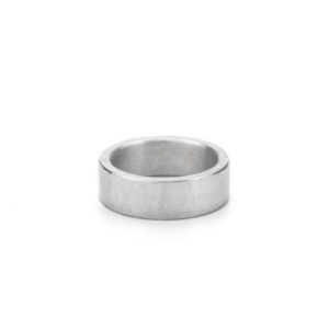 A 10mm wide and solid sterling silver ring. A simple ring with a hammered texture on the surface, giving it a vibrant finish.