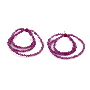 Earrings made of small Rubellite beads. These are strung into three interlocking loops on nylon and equipped with a silver stud.