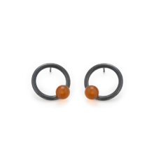 Ring earstuds with a single orange bead.