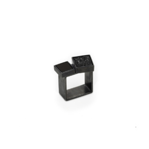Rectangular ring with two onyx stones.